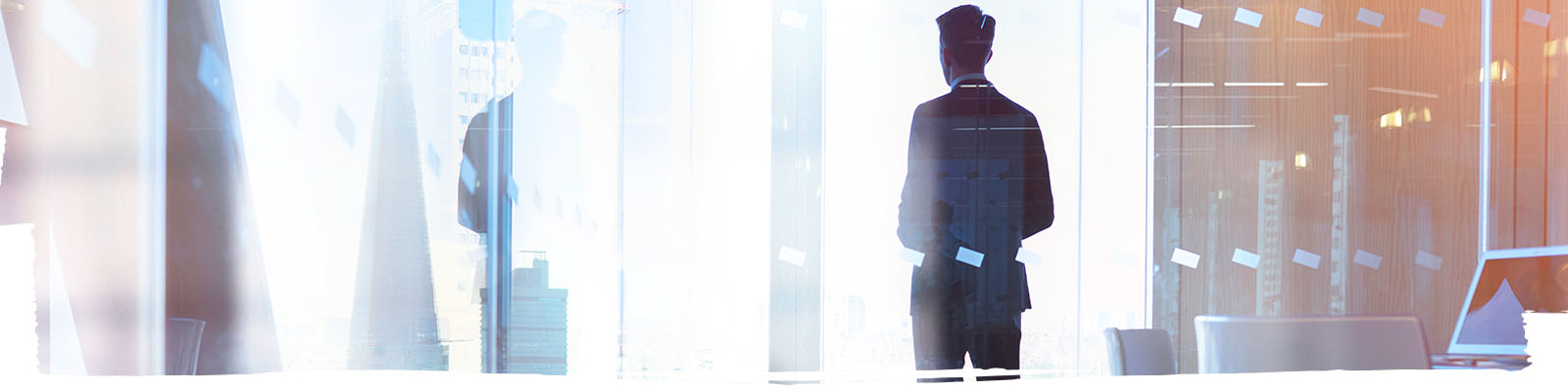 Man looking through a glass window