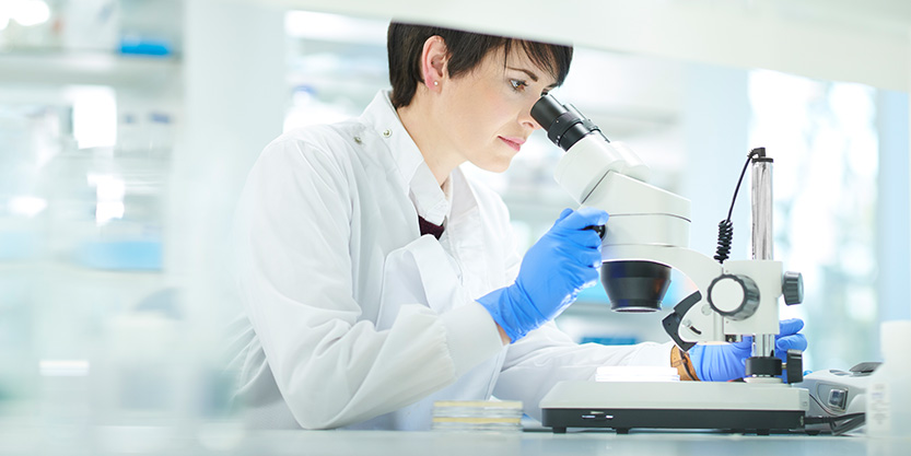 A girl using a microscope