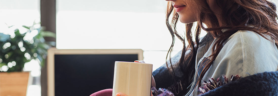 girl drinking from mug