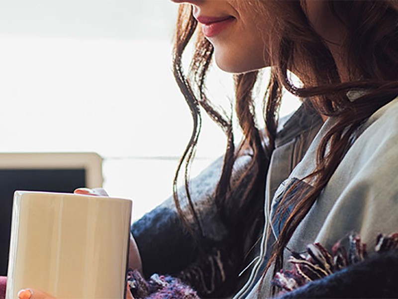 girl drinking from mug