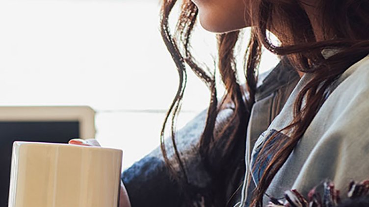 girl drinking from mug