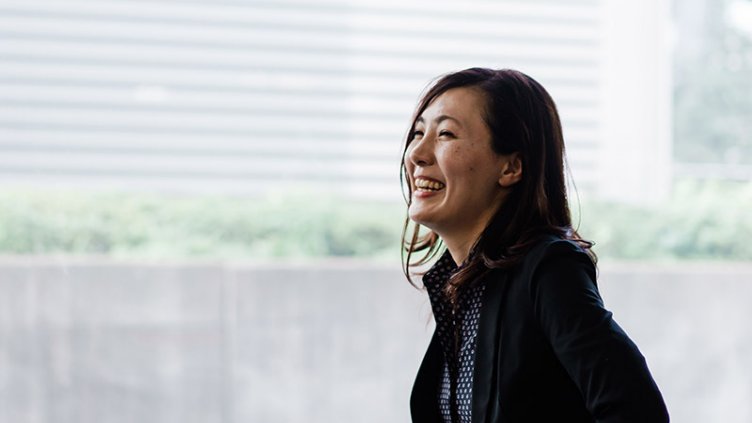 A woman is smiling