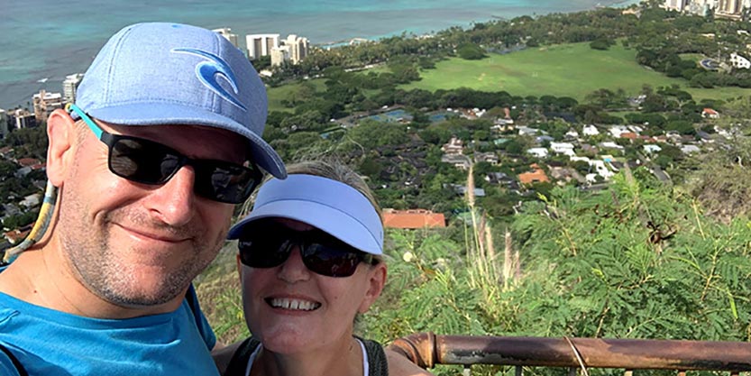 Chris (left) and his wife unwind in Hawaii.