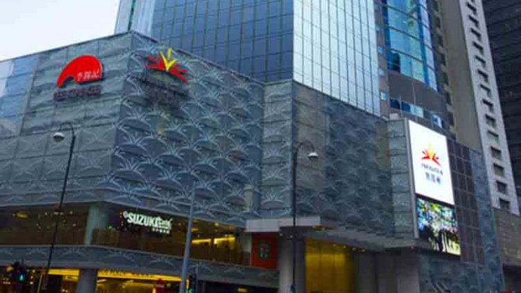 People spending leisure time outside Infinitus Plaza shopping Arcade