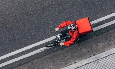 Delivery partner on the way to deliver the food on bicycle.