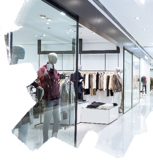 Entrance of fashionable clothes store in shopping mall