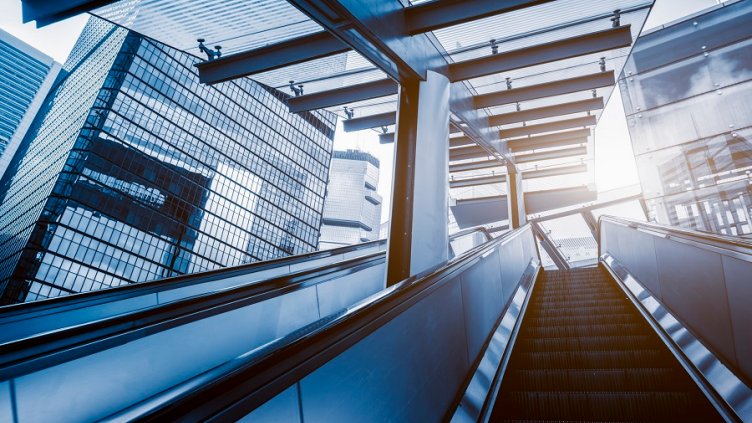 Escalator in Hong Kong downtown district, blue toned.