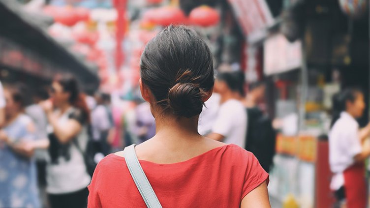 Tourist walking in city streets on Asia vacation tourism