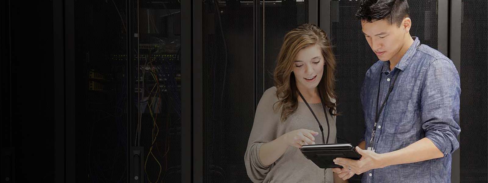 Employees watching tablet and discussing