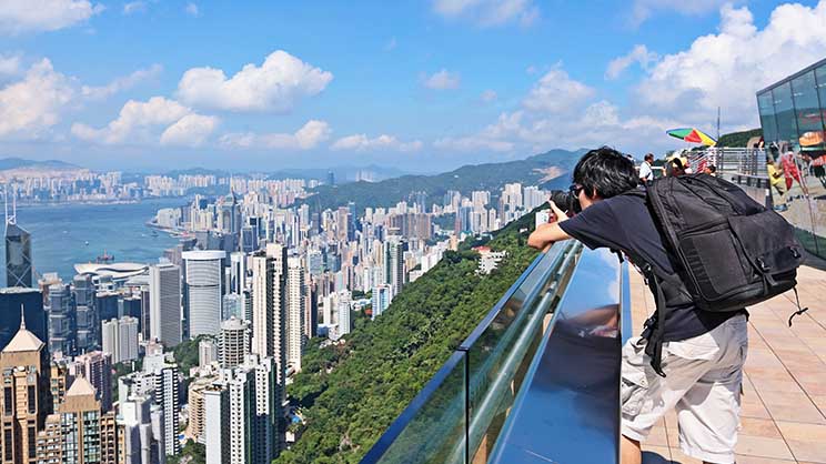 boy taking picture of HK city