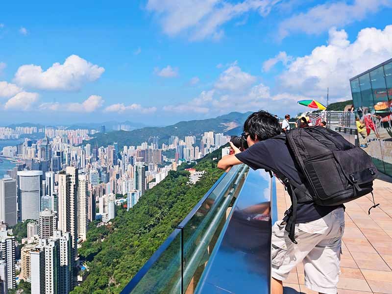Boy taking picture of HK city