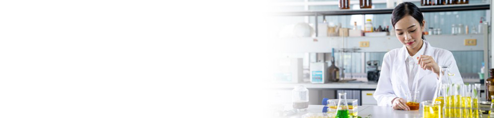 A lab specialist using a beaker and doing a test. 