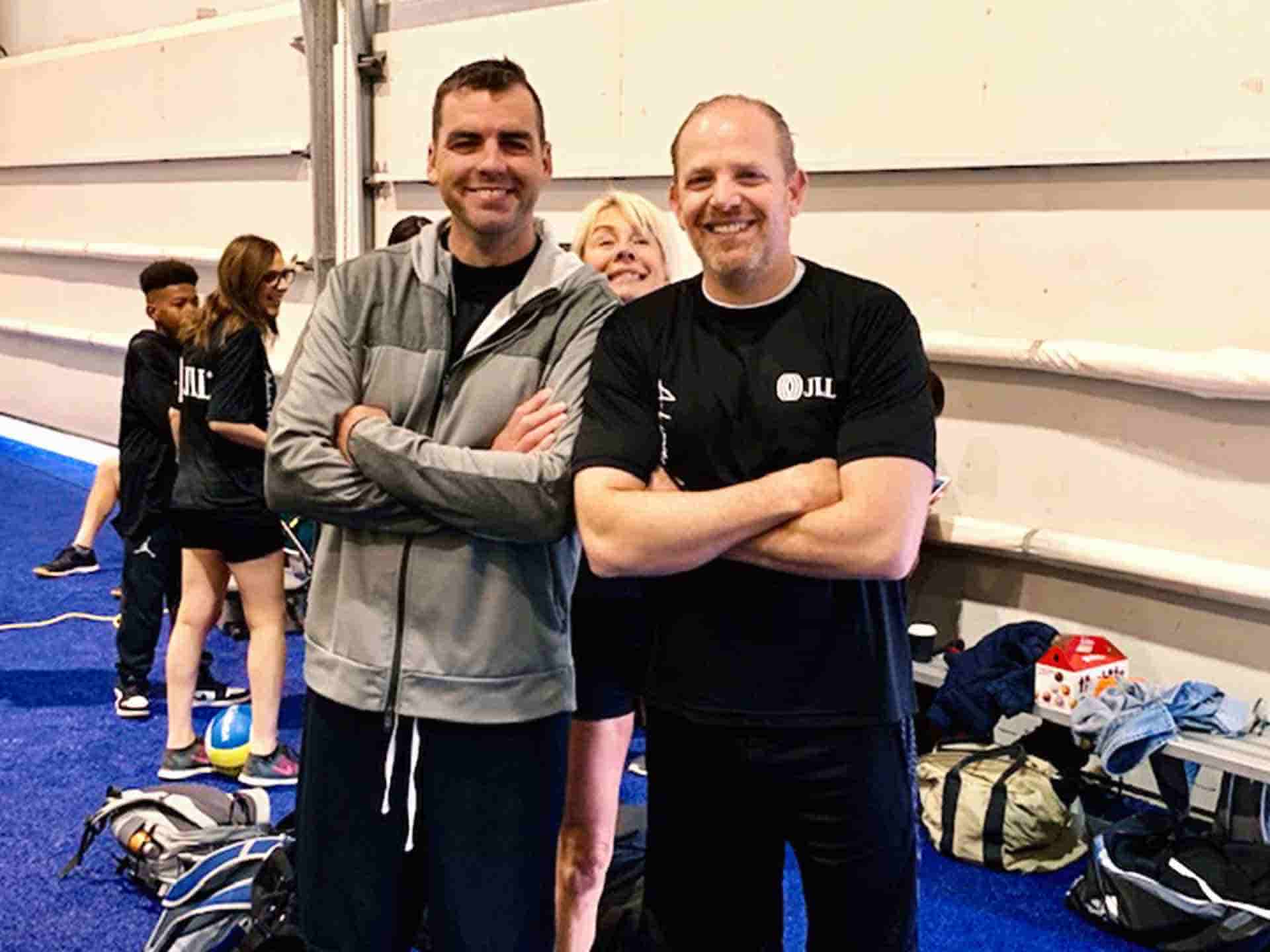 Portrait of smiling volleyball players with coach
