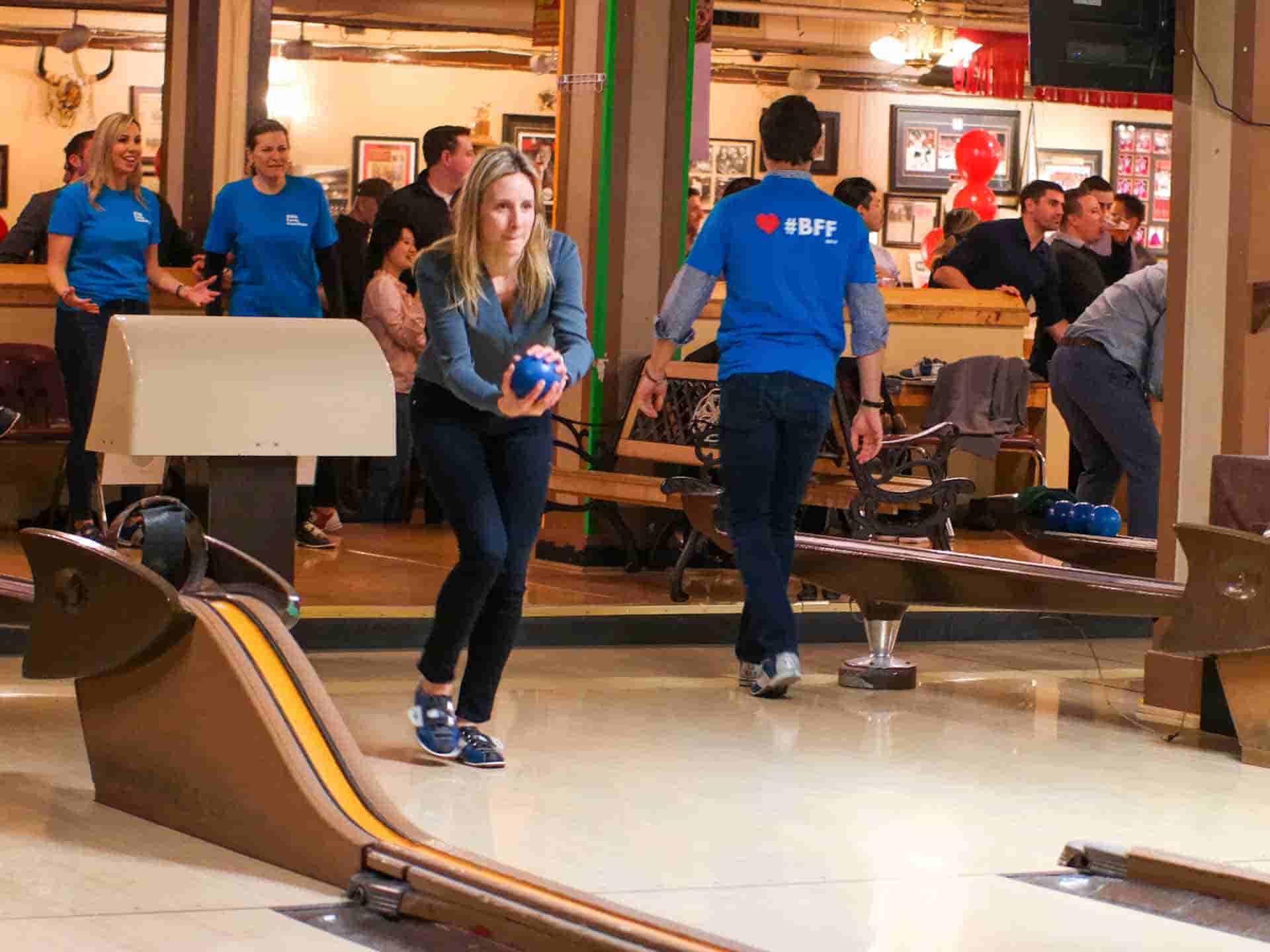 Girl taking a chance to win the game on bowling alley