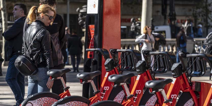 A woman looking at the bicycles