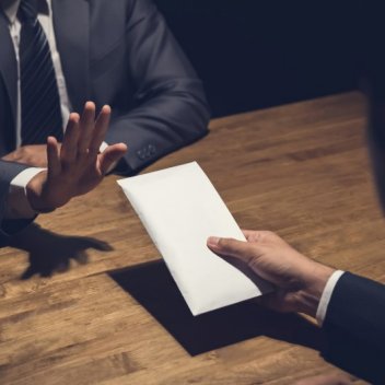 Business man refusing to take money under the table