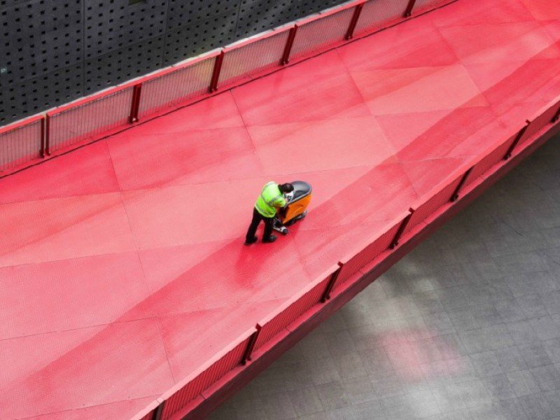 man working on a bridge in warehouse