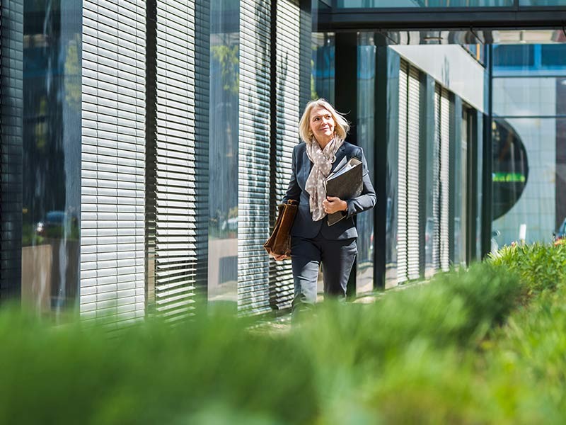 A woman walking in the campus