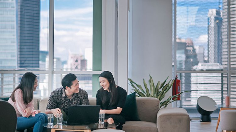 Employees working and smiling