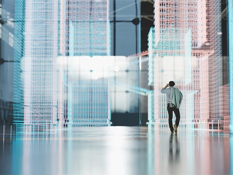 A man is talking on his cellphone while looking at the digitally generated cloud