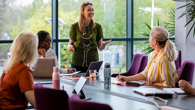 Group of diverse women in a business meeting.